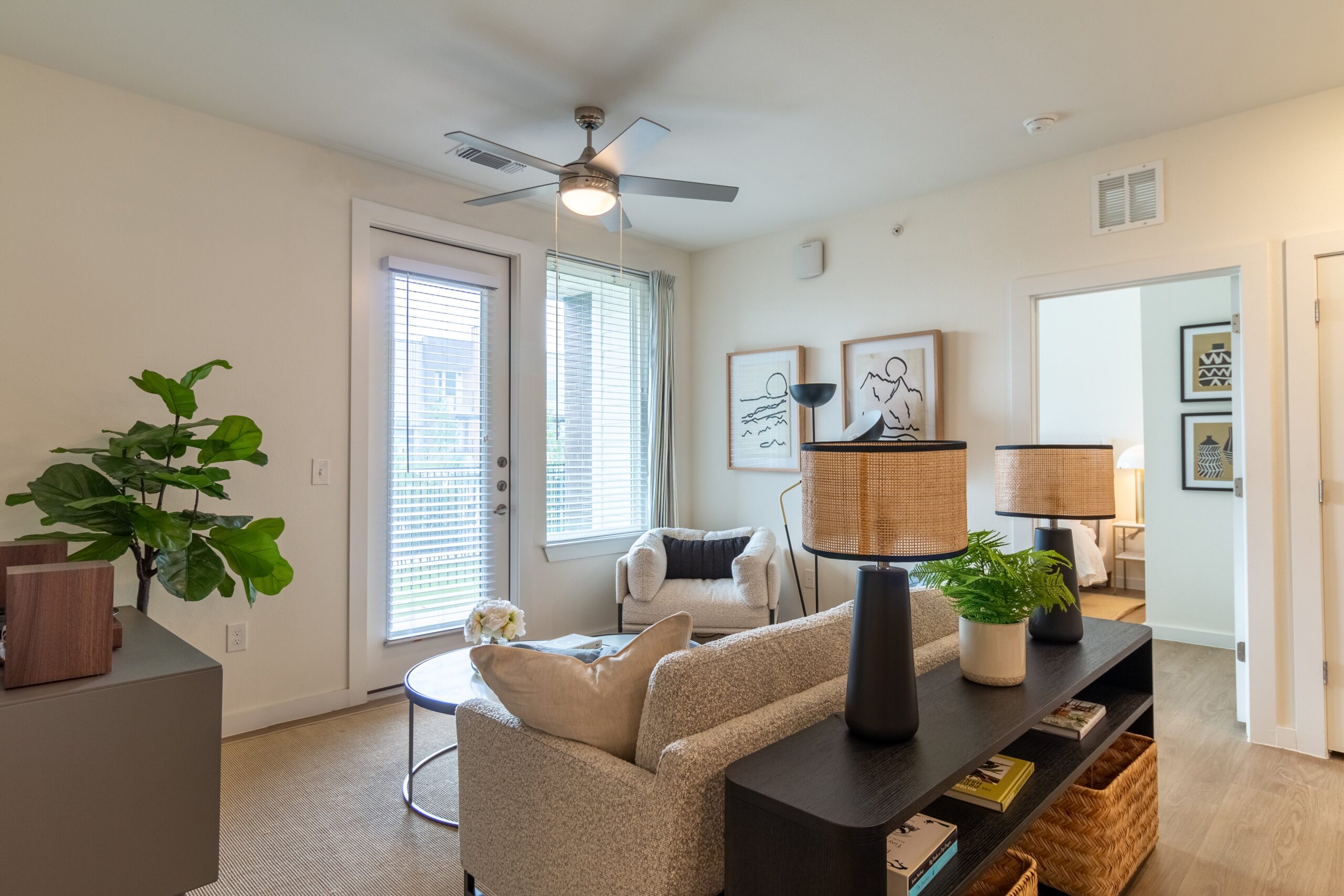Spacious living room with modern finishes and natural light at Potranco Commons apartments